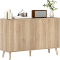 Buffet style scandinave avec 4 portes cannelees, ouverture par pression et etageres ajustables, finition chene